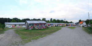 These buildings located off Riverside Drive behind Riverview Station are up for sale. The move comes after city of Asheville officials cut off electricity to the property earlier this year after deeming the buildings unfit for occupancy. About two dozen local artists had been using the buildings for studio space./ Photo by zen sutherland
