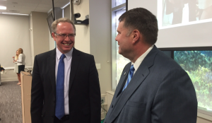 Buncombe County Commissioner Brownie Newman, left, chats with Board of Commissioners Chairman David Gantt last week following Gantt's press conference to announced he would fill out his term but not seek re-election next year.